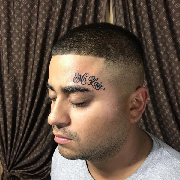 No love forehead tattoo