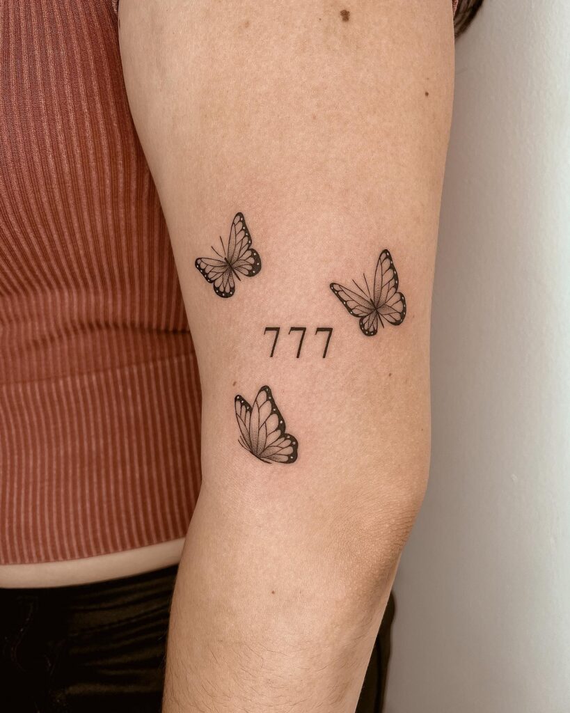 Number 777 with Three Butterflies on the Arm: Traditional Flight 
