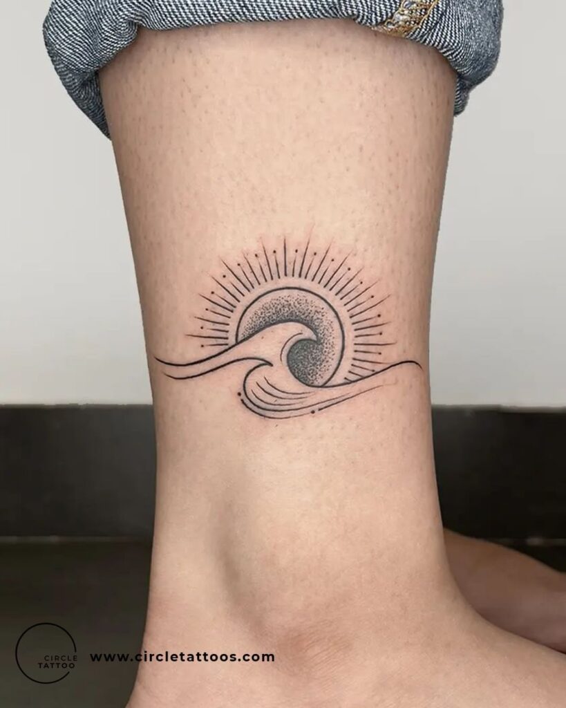 Ocean Sun and Wave Tattoo Above the Ankle Coastal Freedom