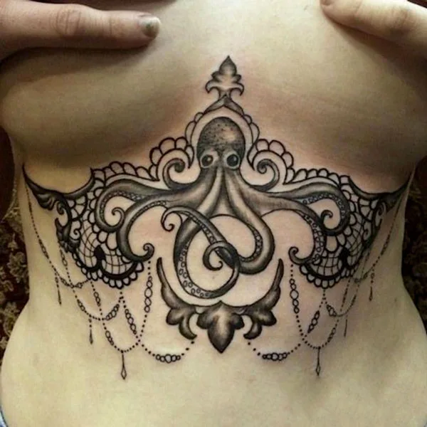 Octopus under breast tattoo