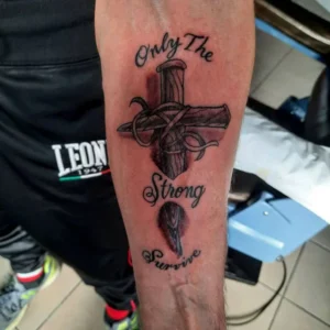 Only the strong survive cross tattoo 1