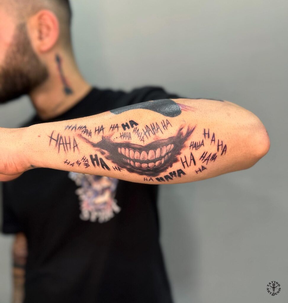 Outer Arm Tattoo: Joker Ha Ha Tattoo Design - Playful and Creative Ink