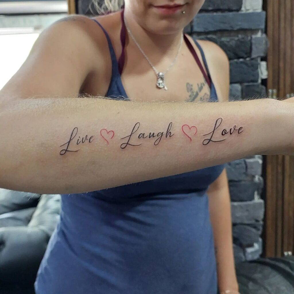 Outer Forearm 'Live ♡ Laugh ♡ Love' Tattoo with Red Heart Accents: Heartfelt Mantra