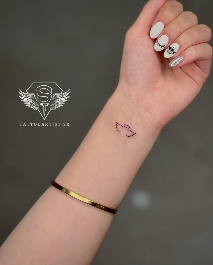 Outline Angel Wing Tattoo on the Inner Wrist, a Whisper of Flight: Feathered Wrist