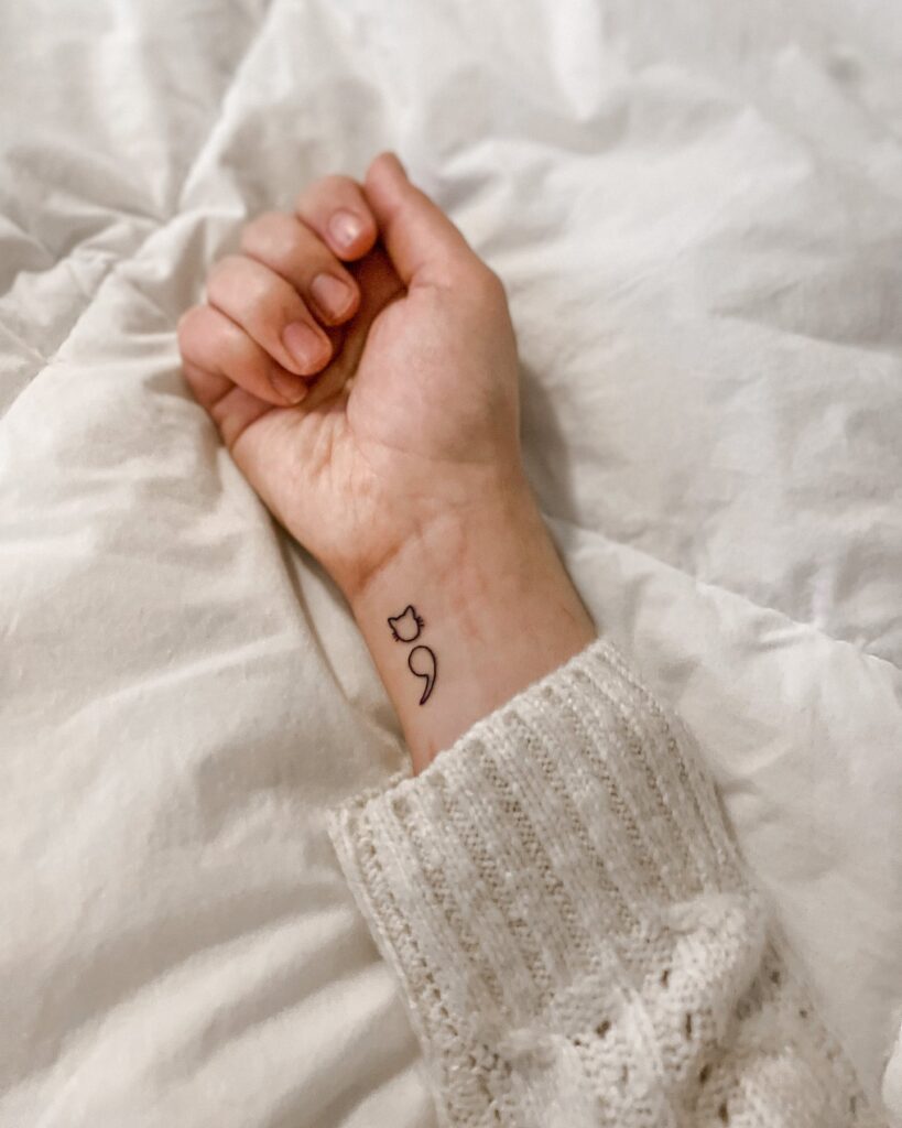Outline Cat Semicolon Tattoo on the Inner Wrist: Classy Companion