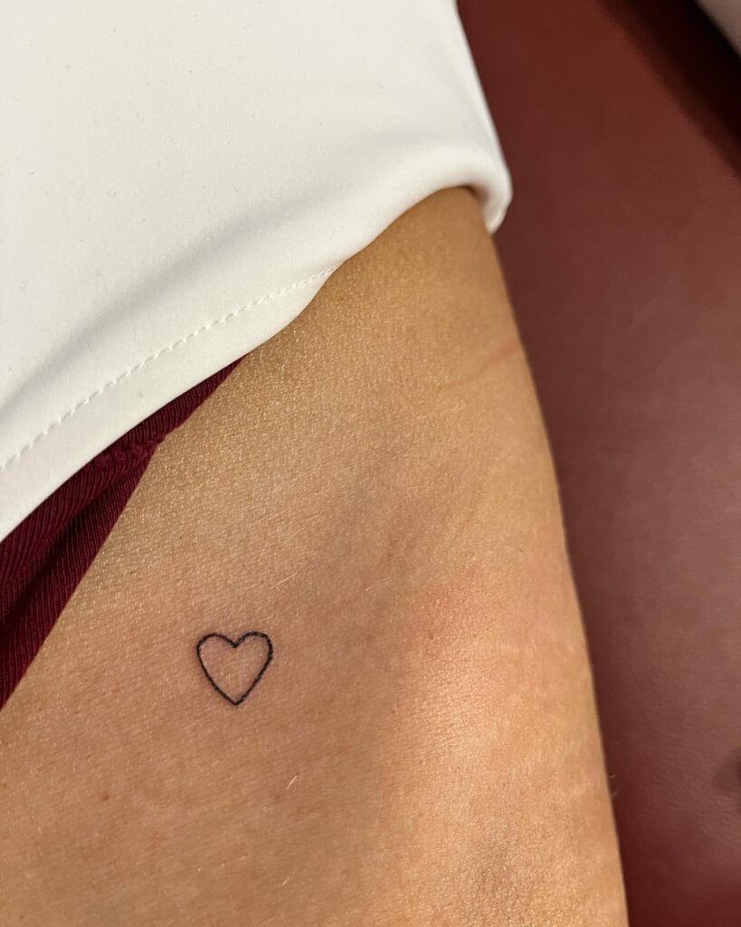 Outline Heart Tattoo on the Hip, a Subtle Emblem of Affection: Heartfelt Charm