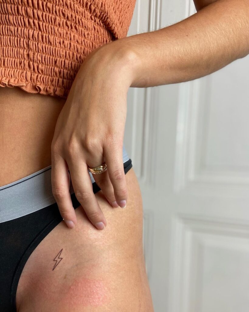 Outline Lightning Bolt Tattoo on the Hip: Electric Edge