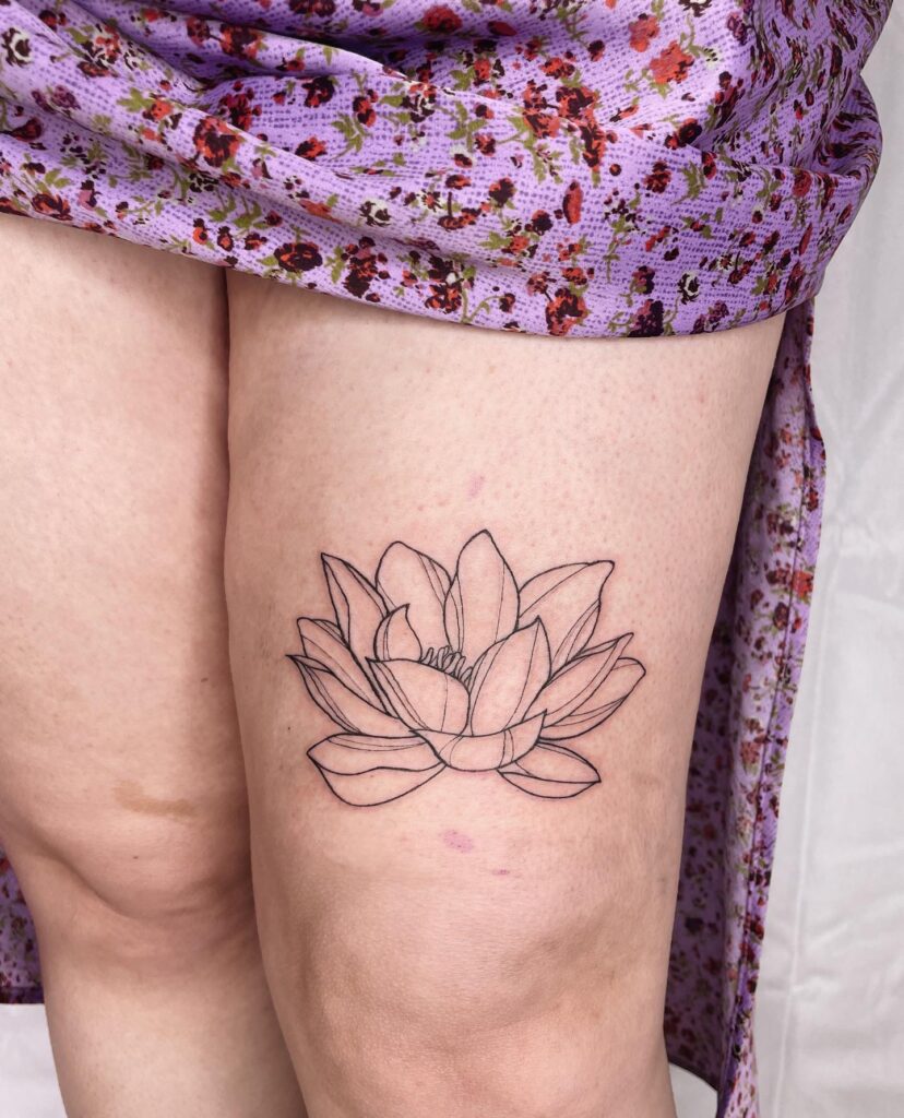 Outline Lotus Tattoo Above the Knee: Elegant Design for Women