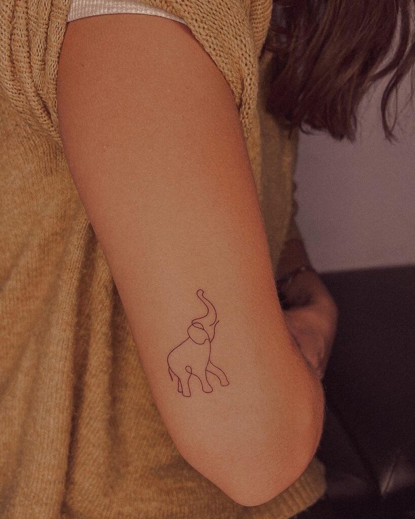 Outline Side View Elephant Tattoo with Lifting Trunk on the Back of the Above the Elbow: Gentle Giants