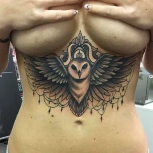 Owl tattoo under breast 1