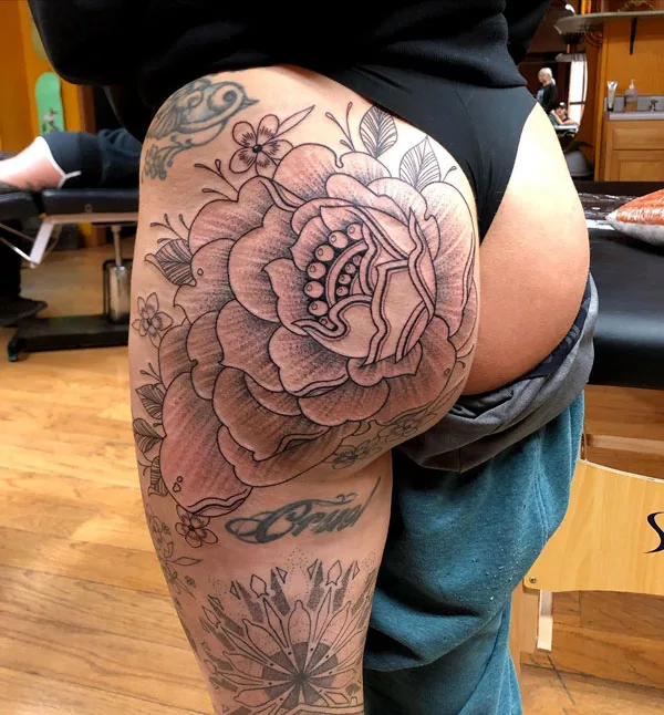 Peony butt tattoo