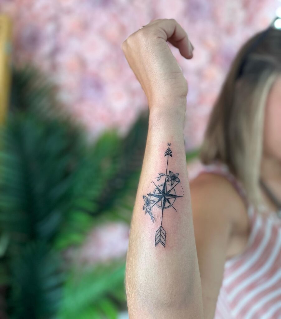 Personalized guidance custom compass & flowers forearm tattoo