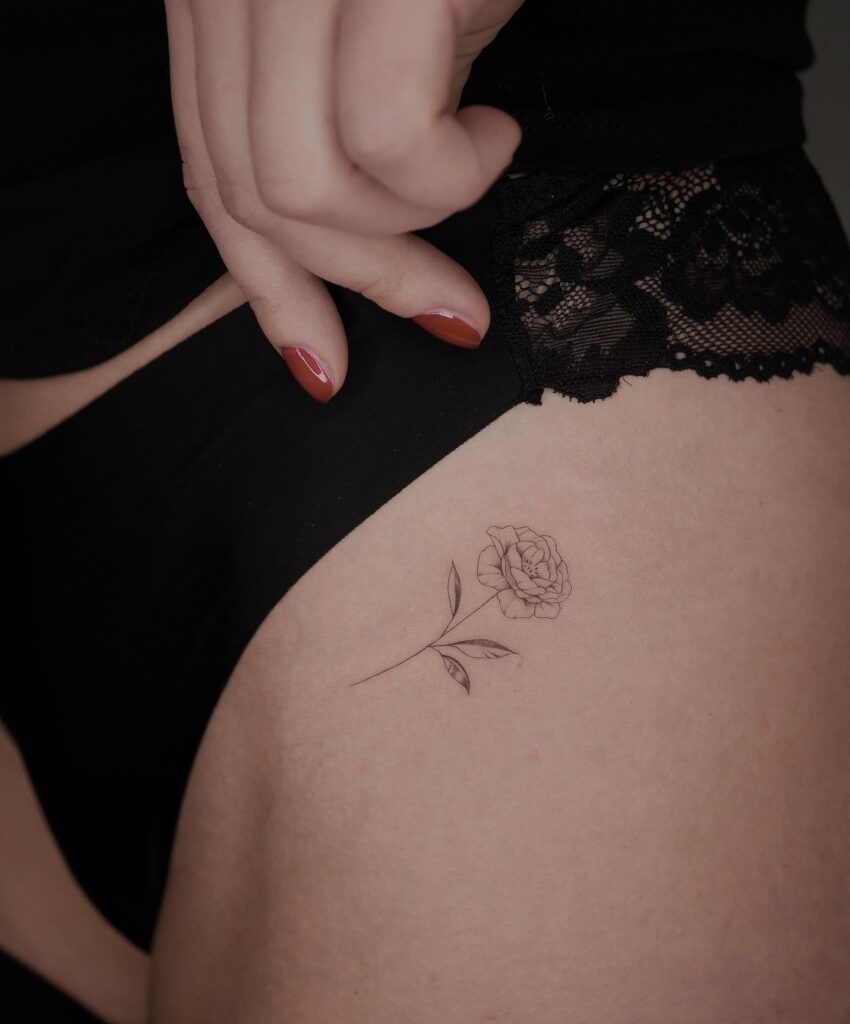Petite elegance little fineline rose flower tattoo on the left hip