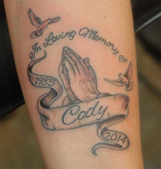 Praying hand rip tattoo for brother