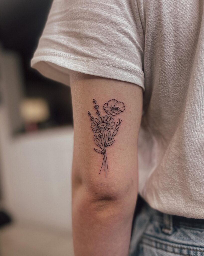 Pretty Little Flower Bunch Tattoo on Back of Arm Subtle Femininity