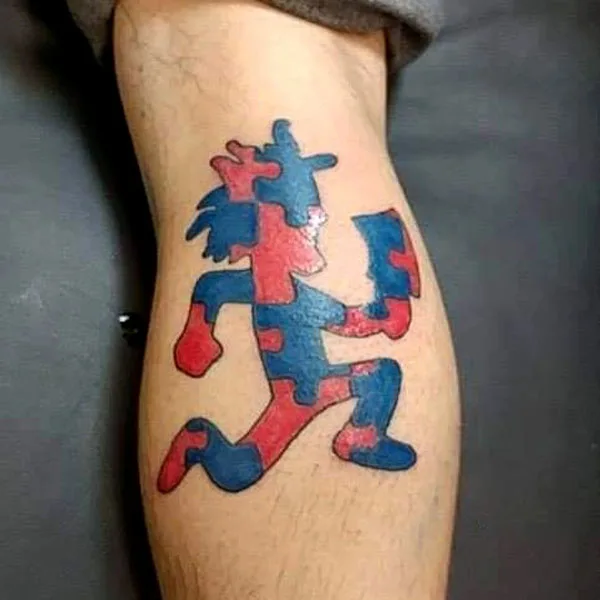 Puzzle pieces hatchet man tattoo
