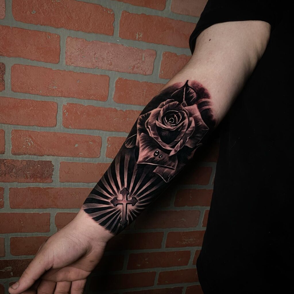 Quarter sleeve rose with cross tattoo floral beauty and faith combined