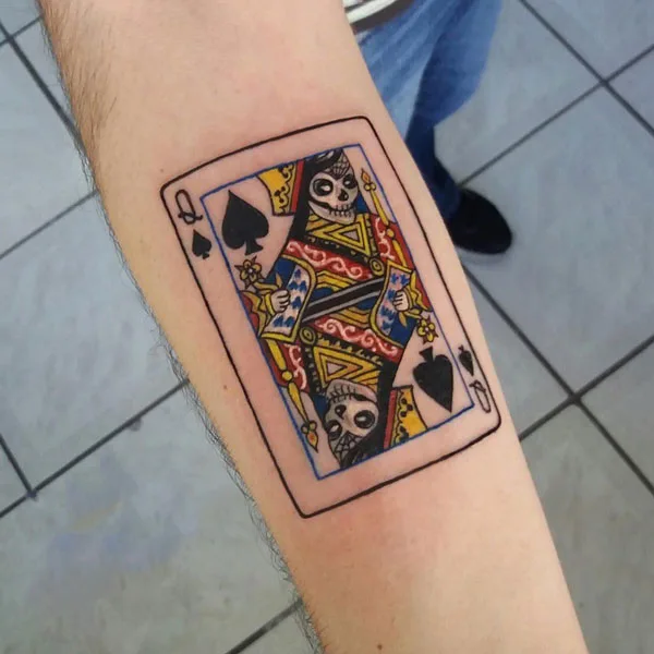 Queen of spade forearm tattoo