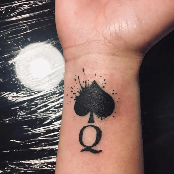 Queen of spade wrist tattoo