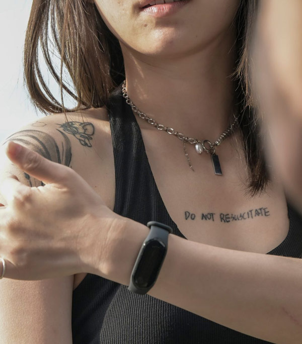 Quotes tattoo on chest