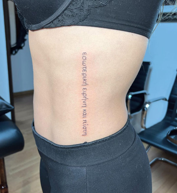 Quotes tattoo on ribs