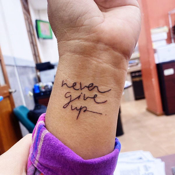 Quotes tattoo on wrist