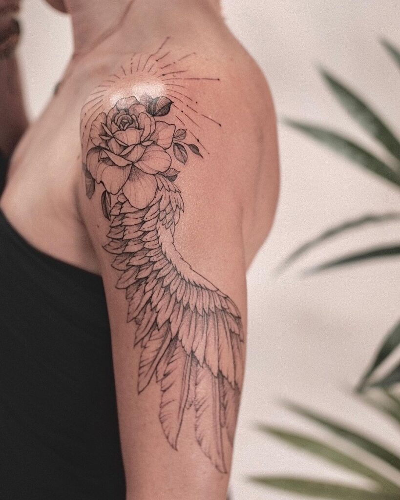 Radiant design wings with rose and sun rays on the shoulder
