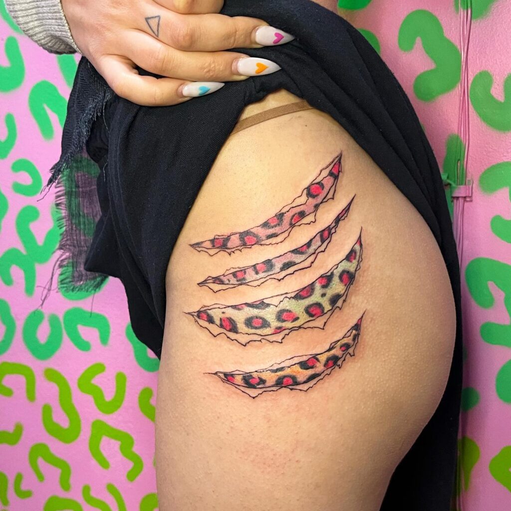 Raw Power and Authenticity: Realistic Leopard Claw Tattoo