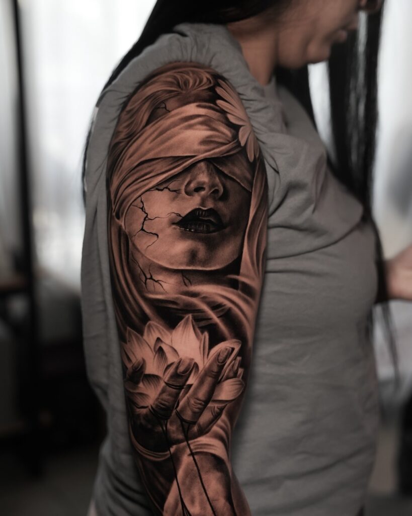 Realistic black and grey tattoo sleeve with blindfolded woman