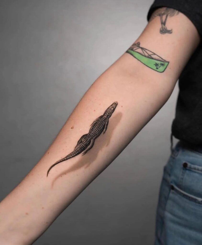 Realistic crocodile forearm tattoo for females