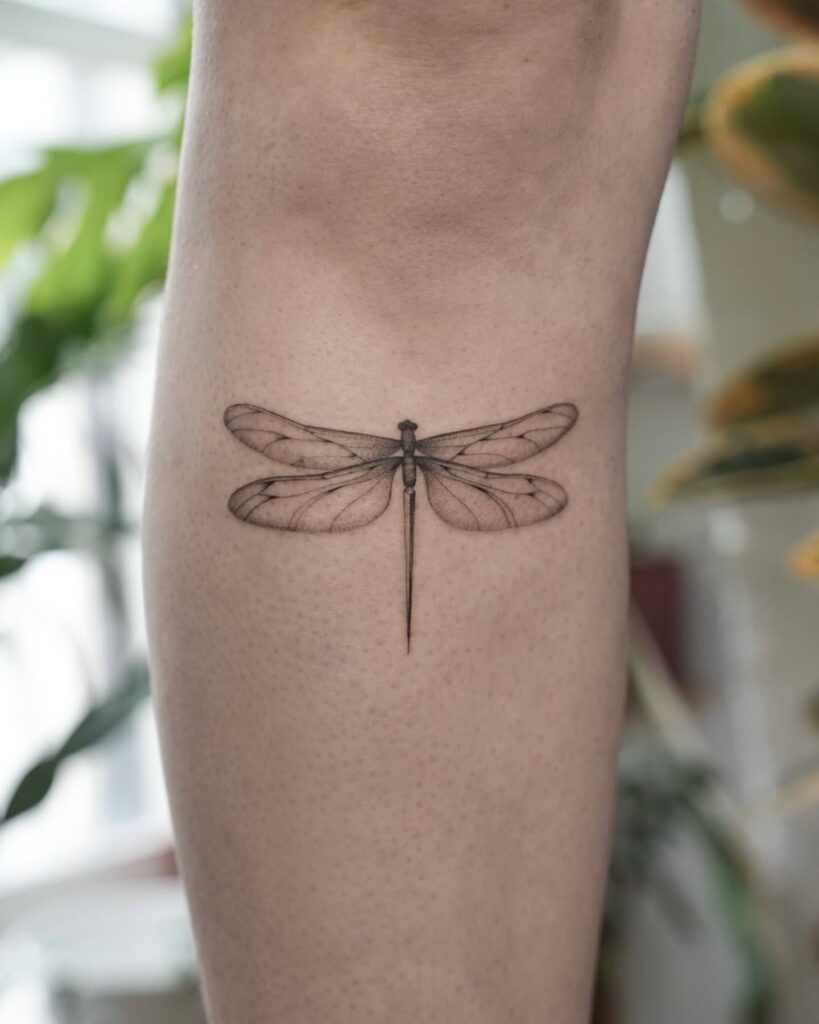 Realistic Dragonfly Tattoo on Leg with Intricate Wing Details