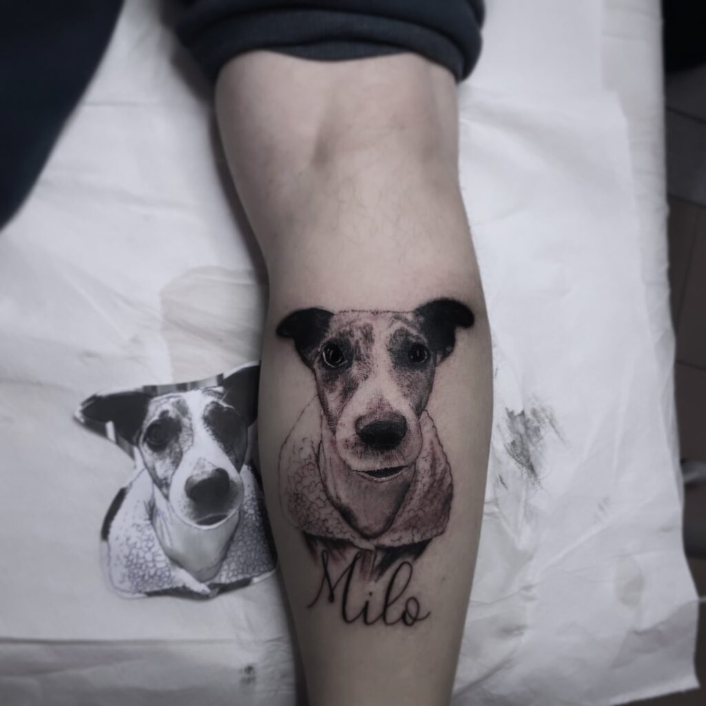 Realistic Face Tattoo with Mila Lettering on the Calf: Jack Russell Joy