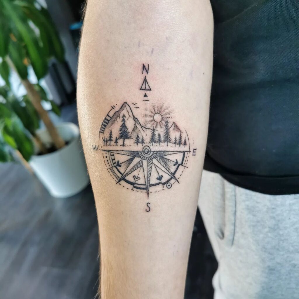 Realistic Half Compass Tattoo Above Mountains and Trees, Creating a Subtle Landscape: Minimalist Guidance