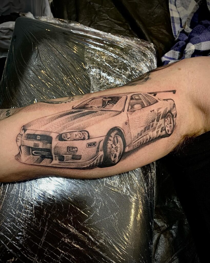 Realistic Nissan Skyline GT-R R34 Tattoo on Forearm with Signature Rear Wing and Depth