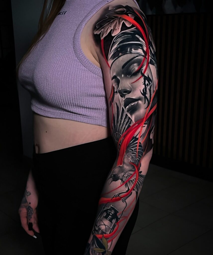 Realistic portrait tattoo sleeve with abstract red accents and symbolic elements for women