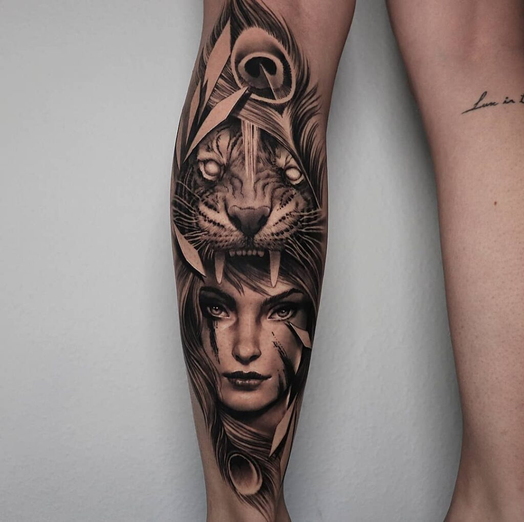 Realistic portrait with tiger and peacock features calf tattoo art 