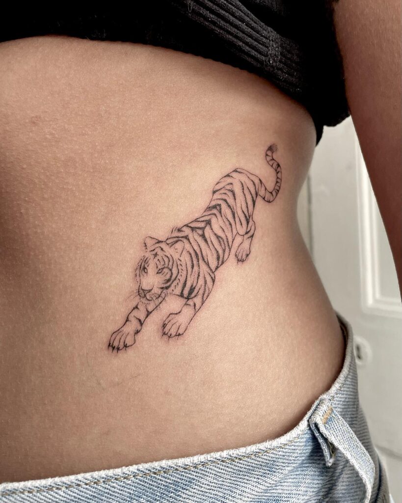 Realistic tiger tattoo making a statement on the rib-roaring majesty