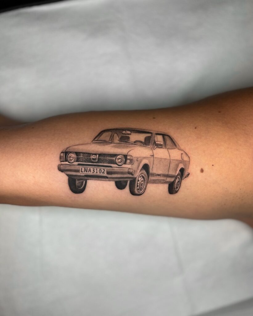 Realistic Vintage Car Tattoo with "LNA3102" License Plate on Inner Arm – Car Tattoo Ideas
