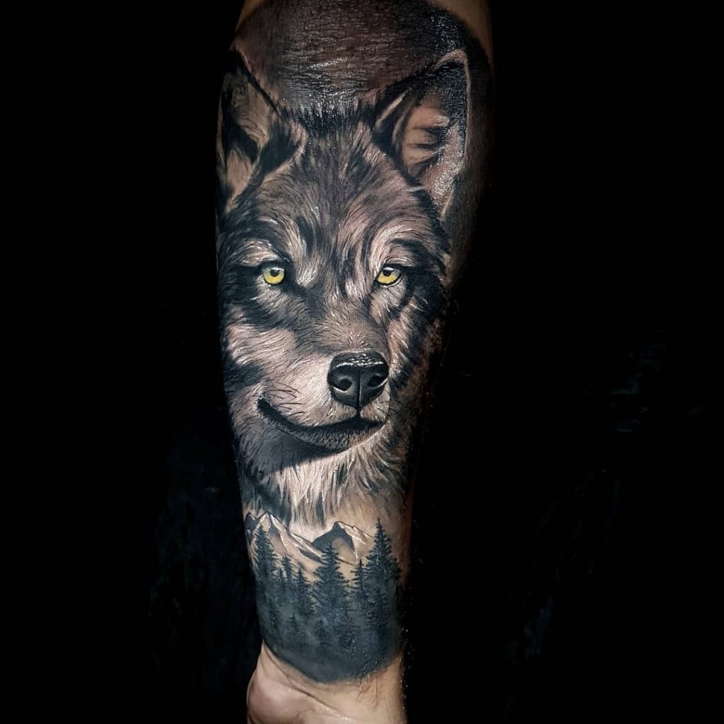 Realistic wolf forearm tattoo