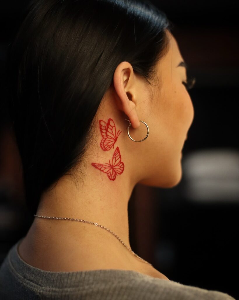 Red Butterfly Tattoo Behind Ear and Neck Delicate and Feminine Ink