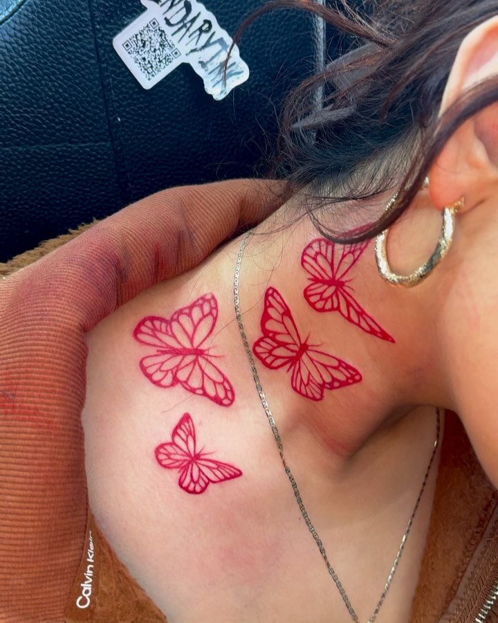 Red Butterfly Tattoo on Neck and Shoulder Elegant and Airy Ink