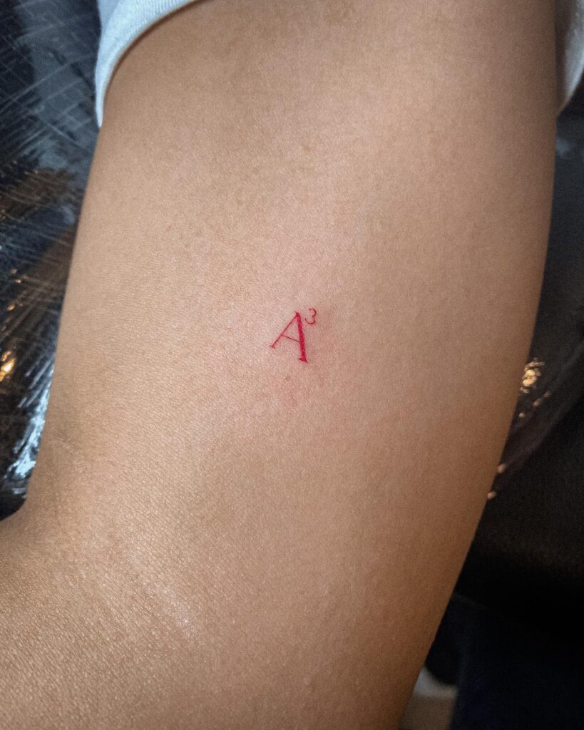 Red Letter 'A3' Tattoo on the Arm for Women: Cubic Expression
