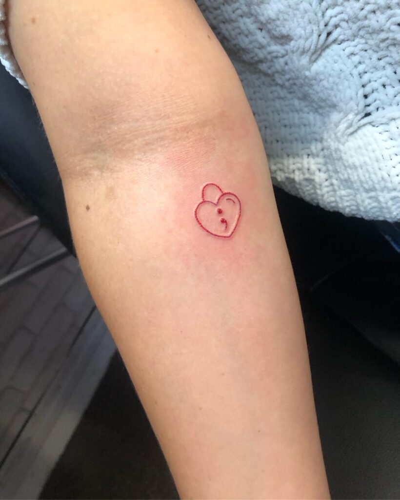 Red Padlock Outline with Semicolon Tattoo Below the Inner Elbow: Locked in Hope