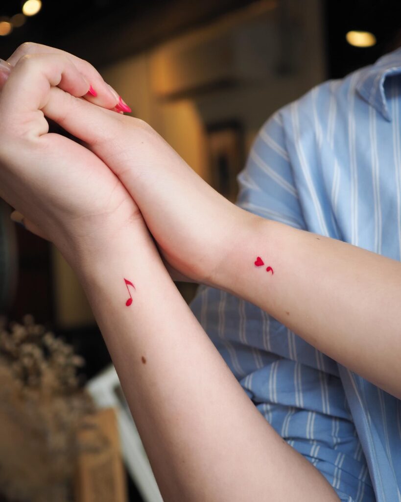 Red Semicolon Heart Tattoo on the Side of the Wrist: Fiery Love