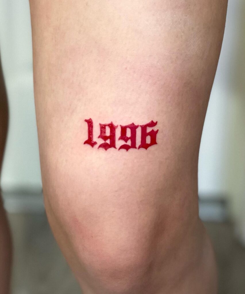 Red year 1996 making a bold statement above the knee