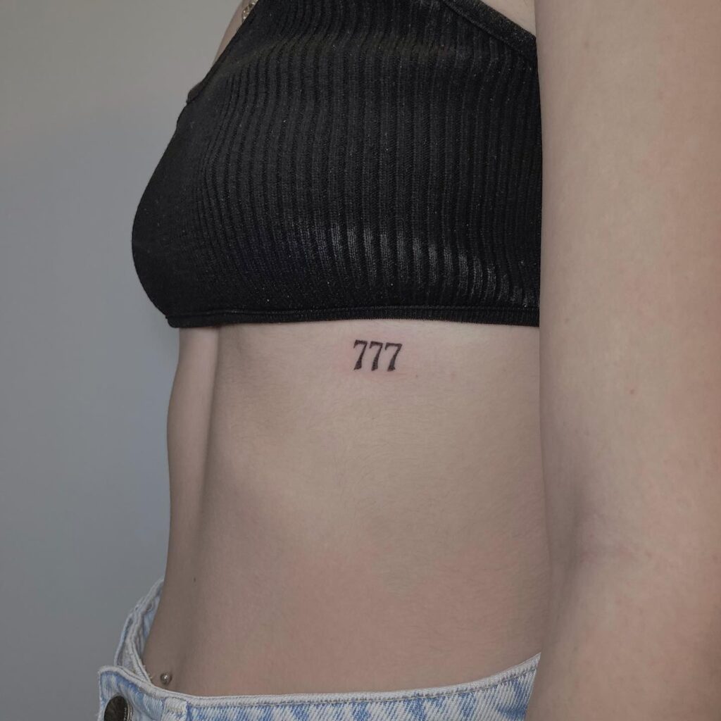 Angel Number 777 Tattoo on the Rib for a Feminine Touch: Rib Harmony 