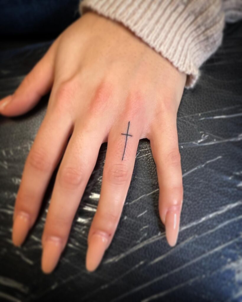 Ring Finger Cross Tattoo Design Elegant and Meaningful