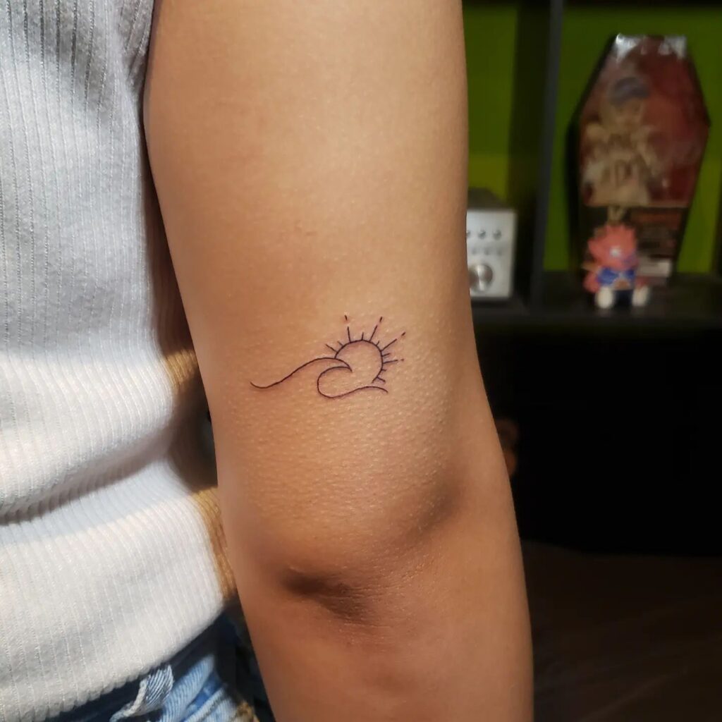 Rolling Wave And Sun Tattoo For Arm