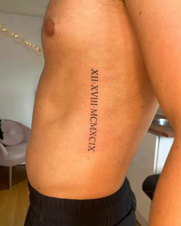 Roman Numerals Rib Tattoo