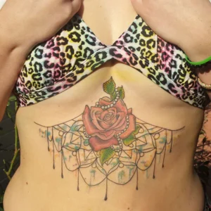 Rose under boob tattoo 1